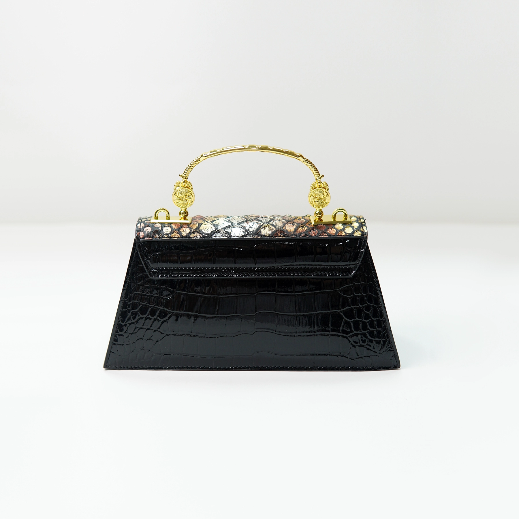 Structured black crocodile-embossed handbag sample for custom handbag manufacturing review