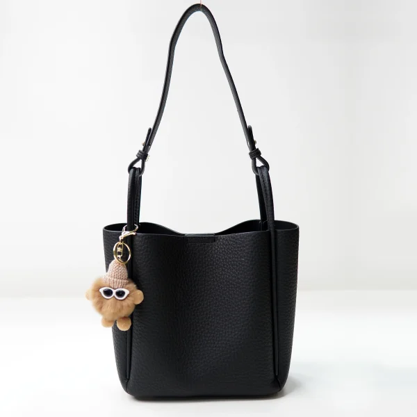 Black pebbled handbag sample documented for private label handbag production review