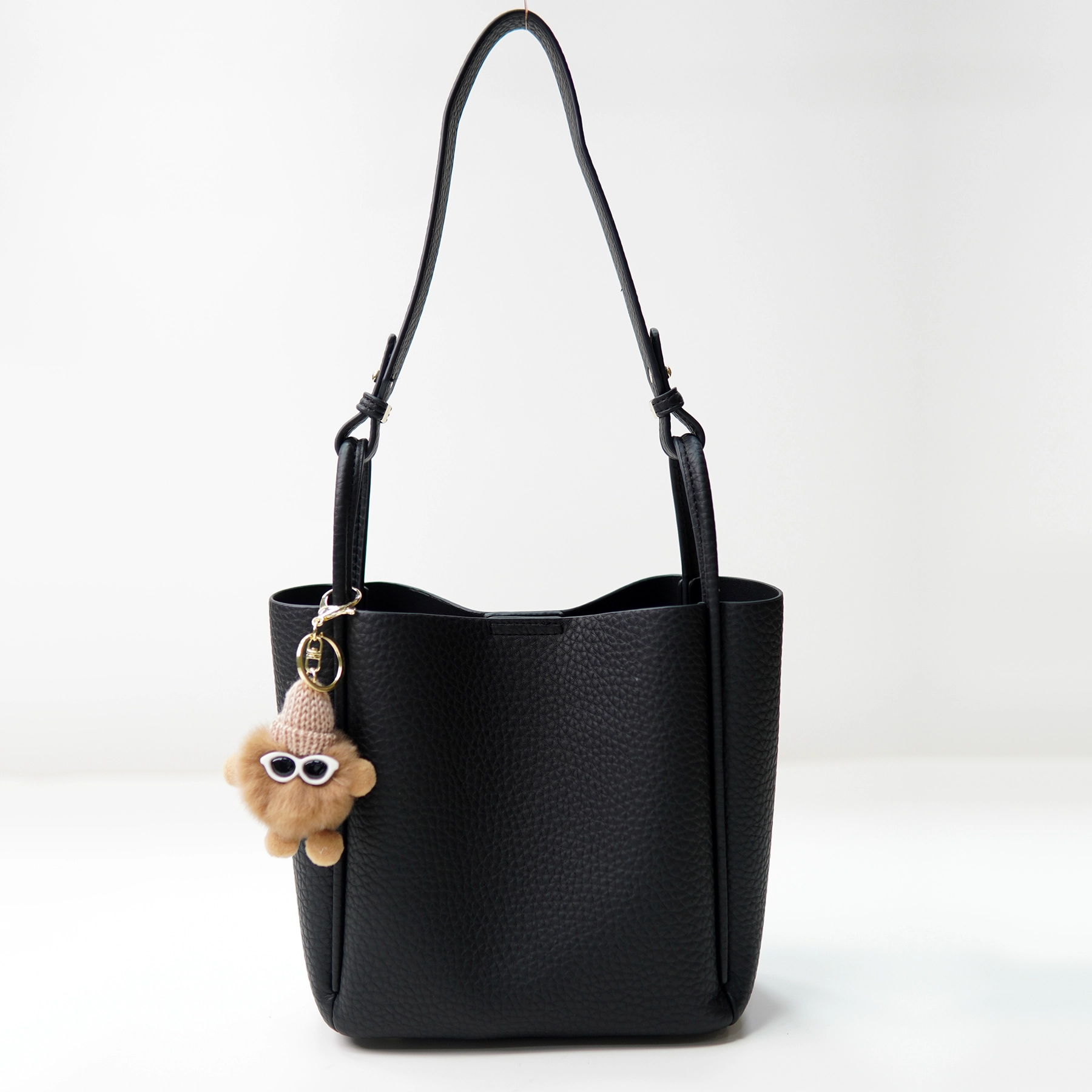 Black pebbled handbag sample documented for private label handbag production review