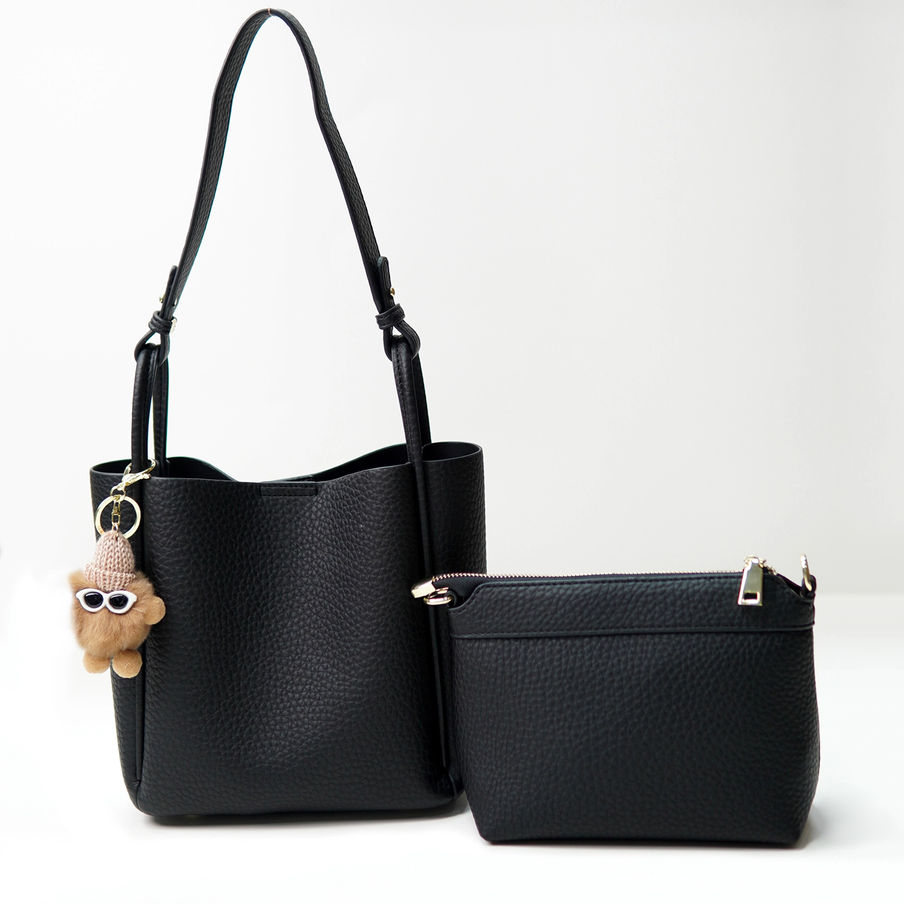 Black pebbled handbag set documented for custom handbag manufacturing review