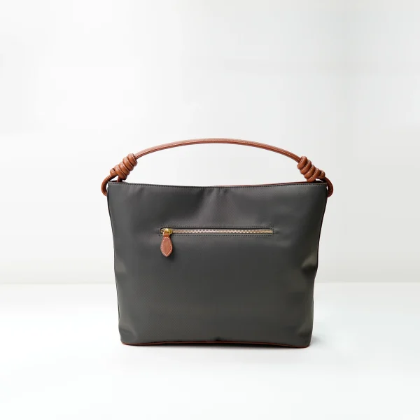 Custom handbag manufacturer sample with black body brown handle and front zipper