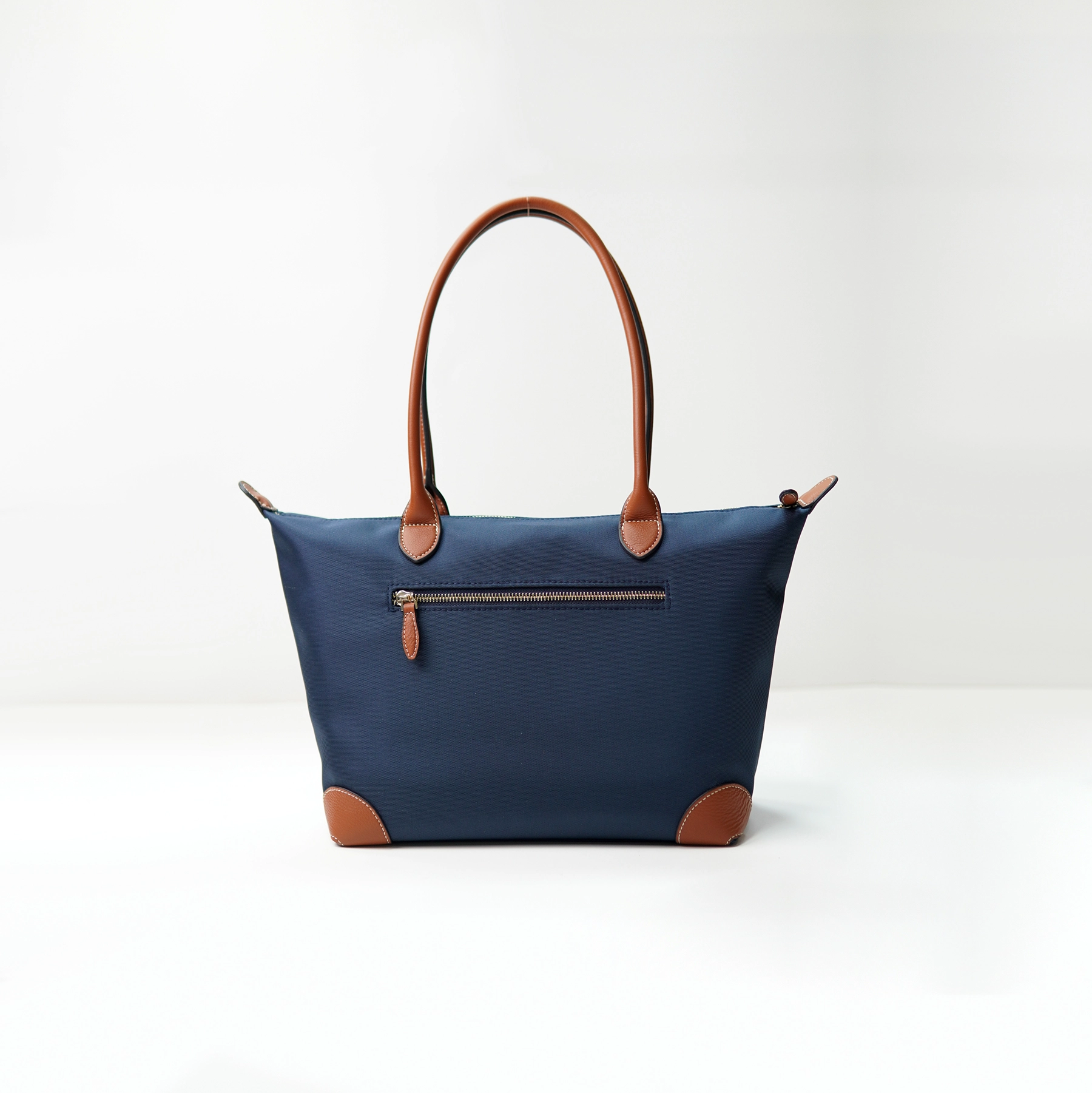Navy tote bag sample documented for custom handbag manufacturing review