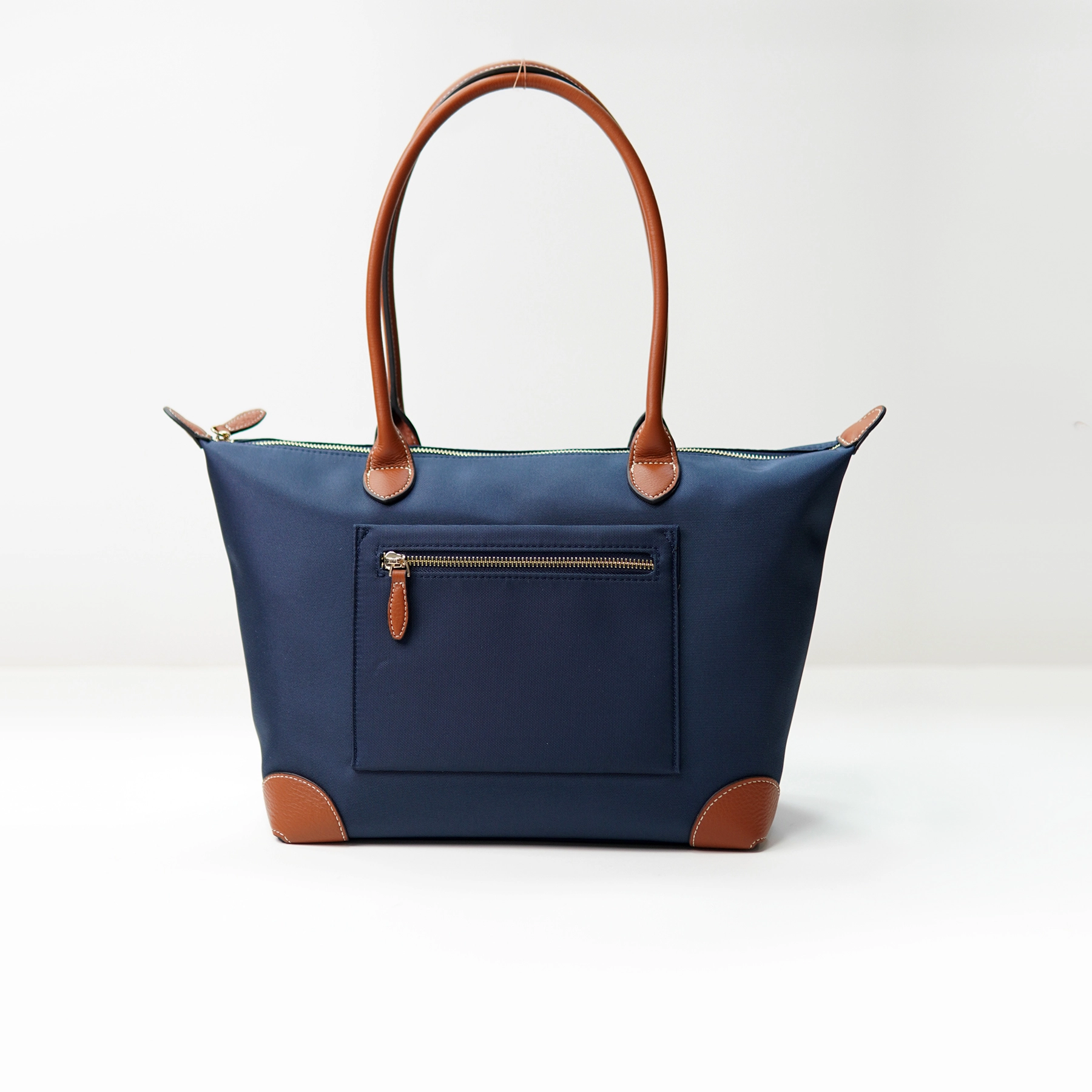 Navy tote bag sample documented for custom handbag manufacturing review