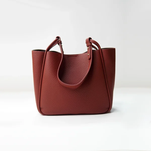Pebbled leather tote sample documented for custom handbag manufacturing review