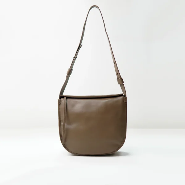 Brown shoulder bag sample documented for custom handbag manufacturing review