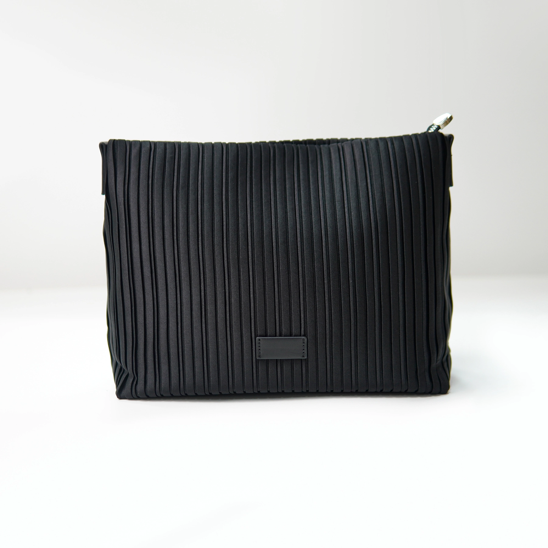 Black pleated clutch sample for custom handbag manufacturing review