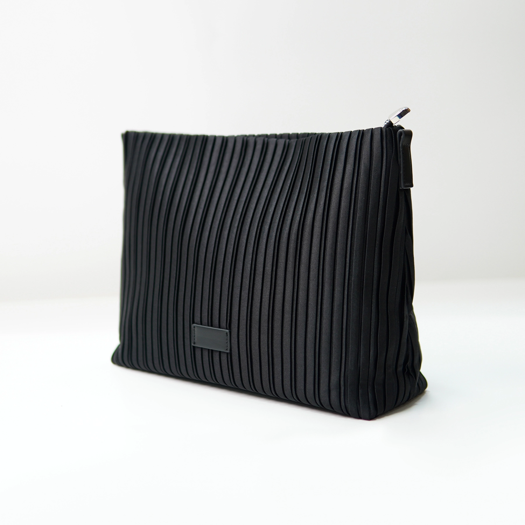 Black pleated clutch sample for private label handbag production review