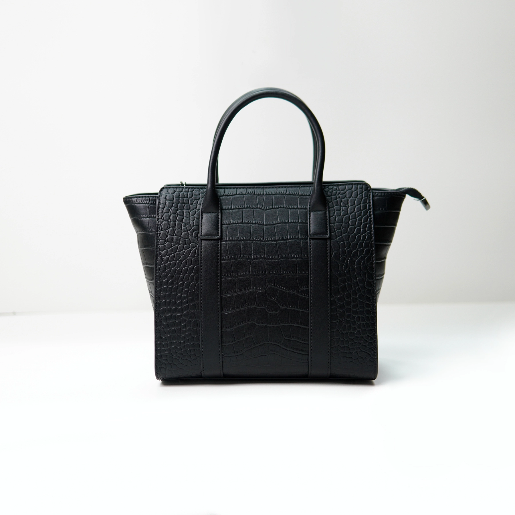 Black crocodile-embossed tote bag sample for custom handbag manufacturing review