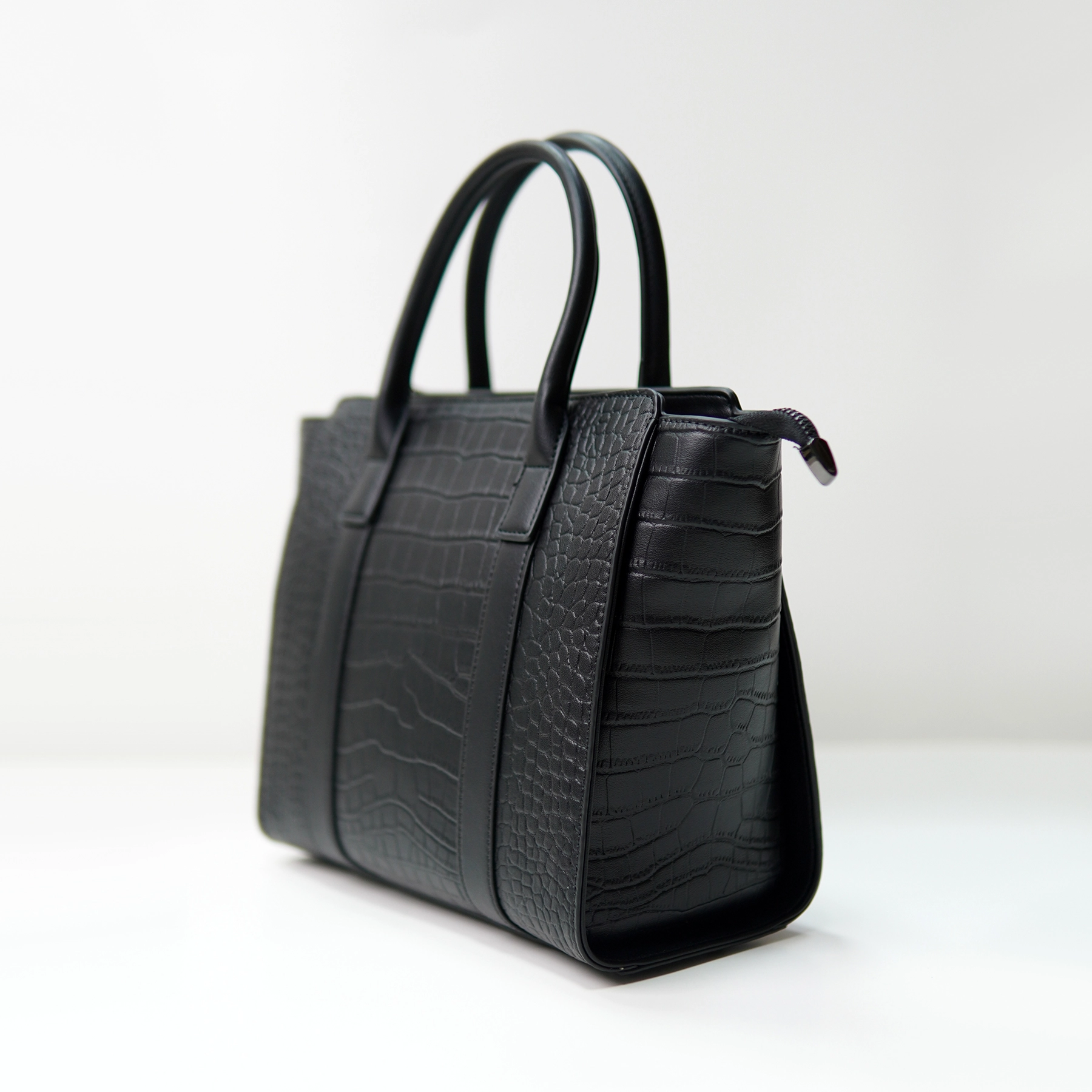 Black embossed handbag sample for custom handbag manufacturing review