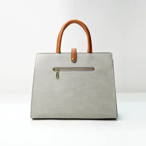 Structured tote bag sample for custom handbag manufacturing with zipper pocket