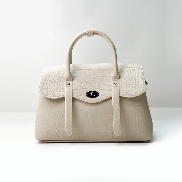 Embossed leather handbag sample for custom handbag manufacturing review