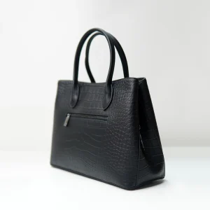 Black embossed handbag sample documented for custom handbag manufacturing review