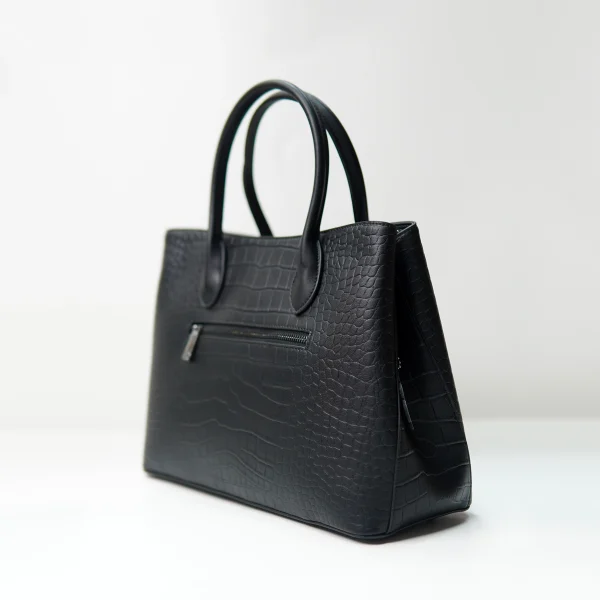 Black embossed handbag sample documented for custom handbag manufacturing review