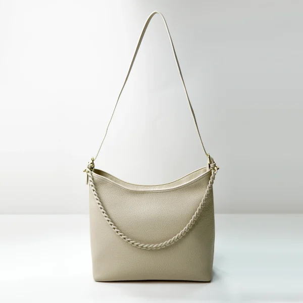 Beige pebbled shoulder bag sample for custom handbag manufacturing review