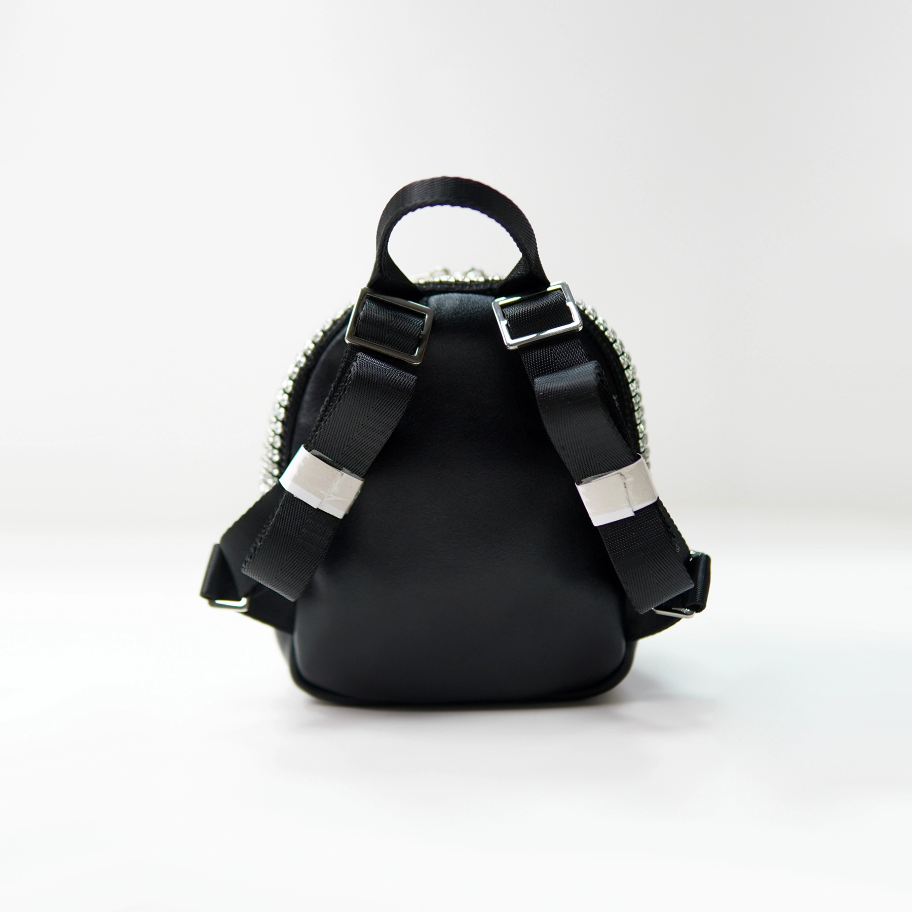 Mini backpack rear panel with webbing straps for custom handbag manufacturing