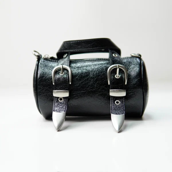 Black barrel handbag sample with buckle hardware for custom handbag manufacturing