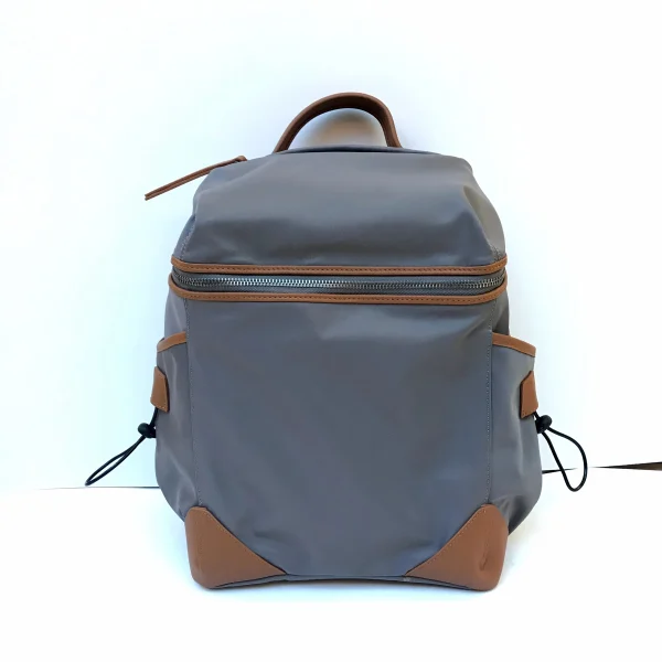 Custom handbag manufacturer sample backpack with zipper assembly and reinforced corner panels