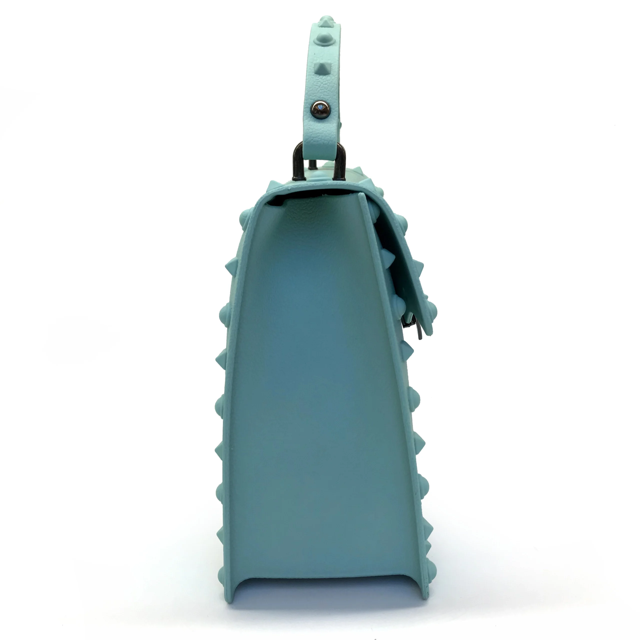 Side view of turquoise handbag sample for custom handbag manufacturing review