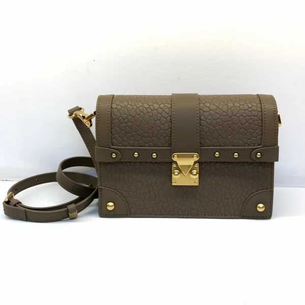 Structured shoulder bag sample for custom handbag manufacturing with hardware alignment