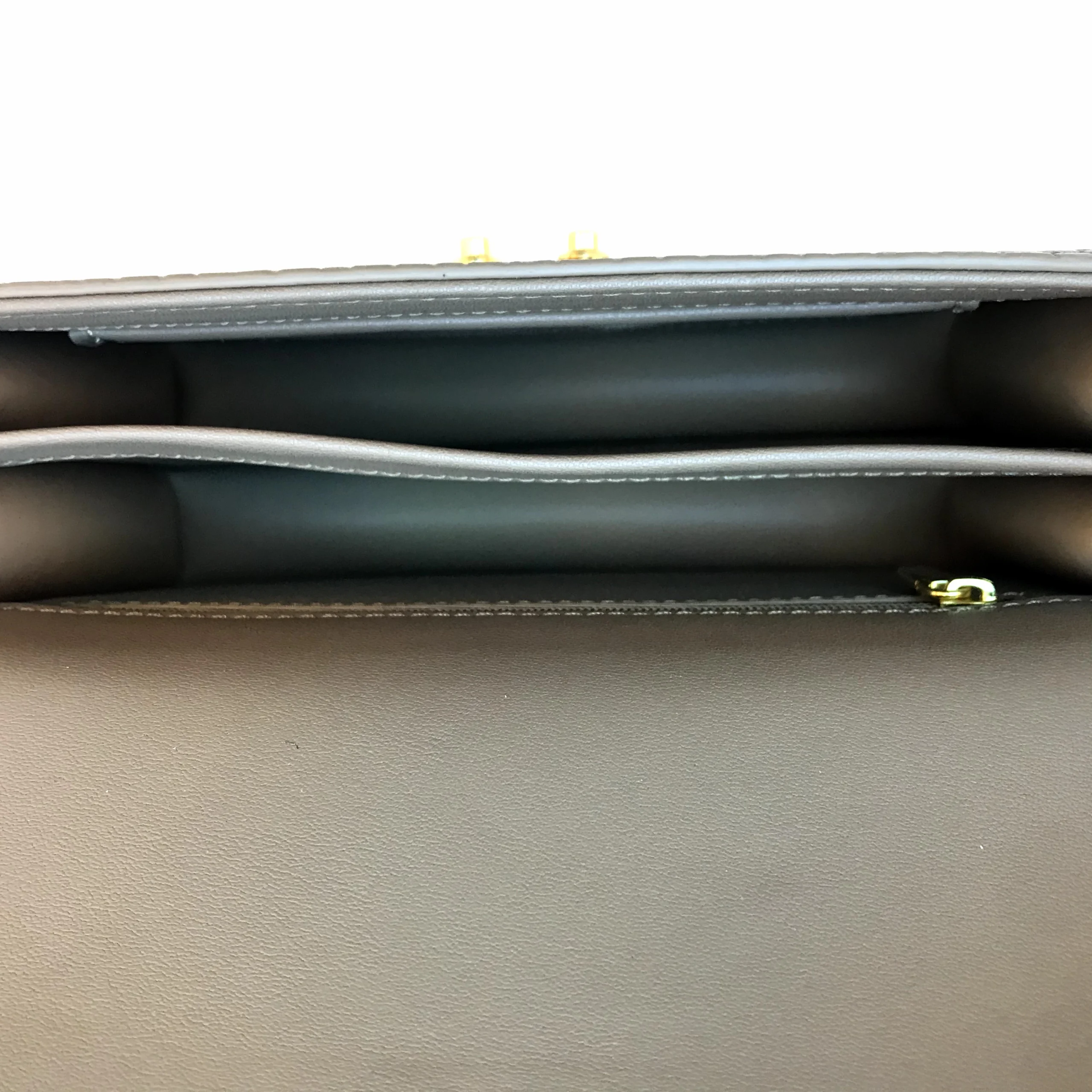 Handbag interior seams and zipper hardware for custom handbag manufacturing inspection