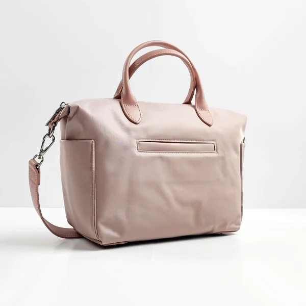 Pink handbag sample with handles and strap for custom handbag manufacturing review