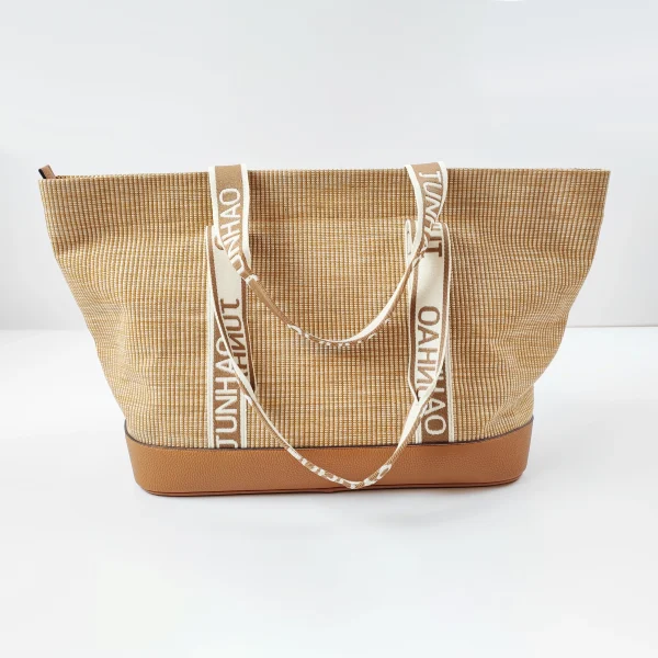 Woven tote bag sample with branded straps for custom handbag manufacturing