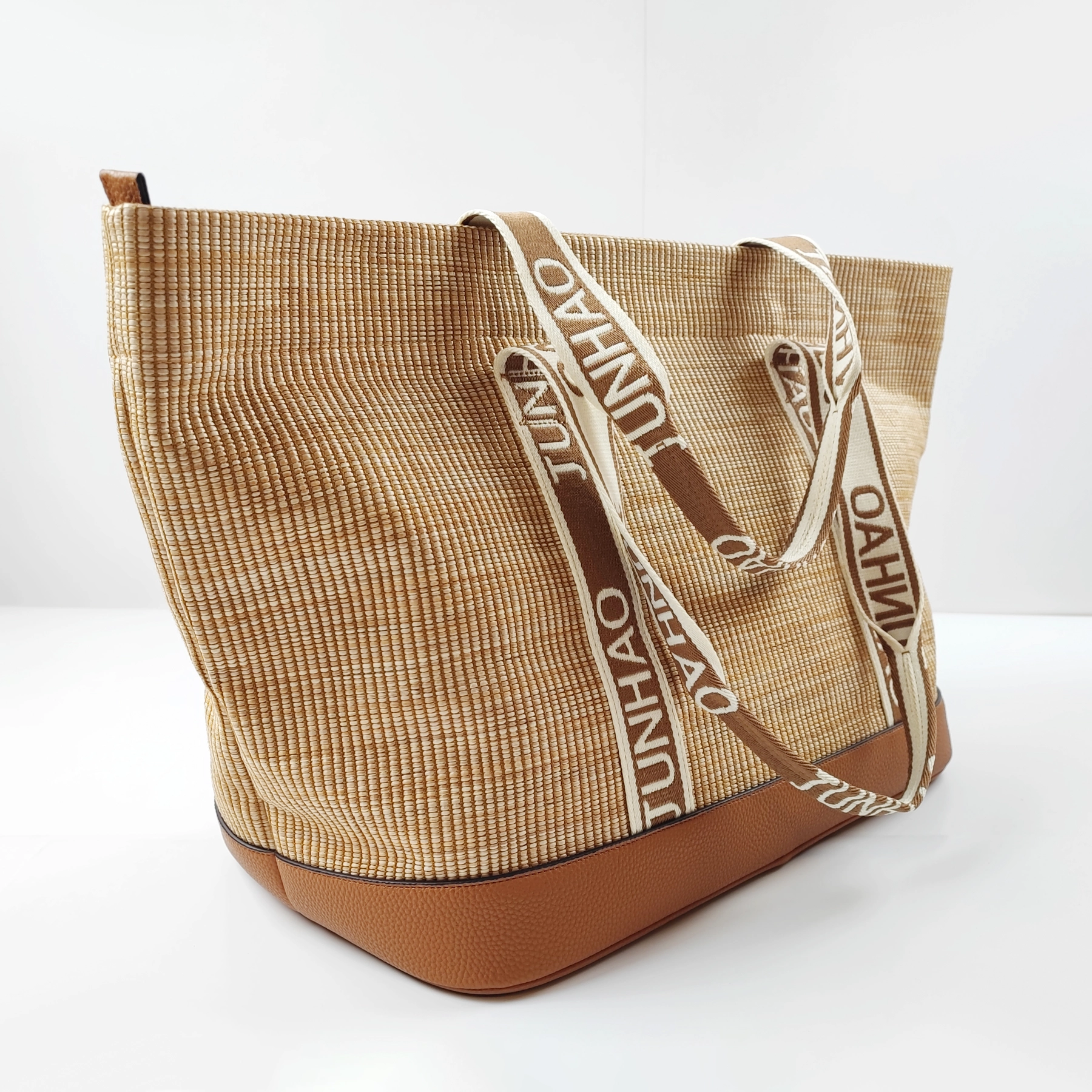 Woven tote bag sample with branded straps for private label handbag production
