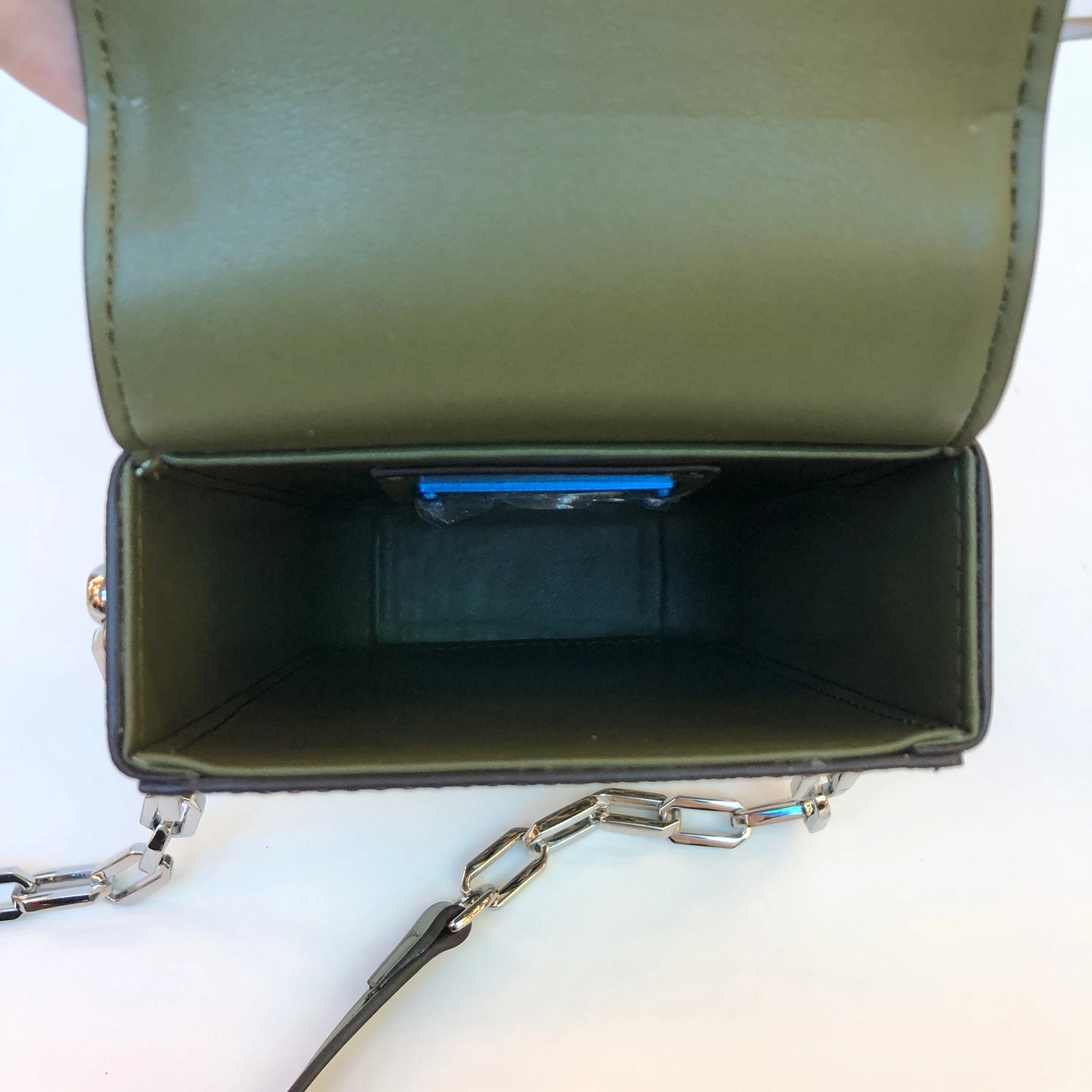 Open structured handbag sample showing interior lining for custom handbag manufacturing