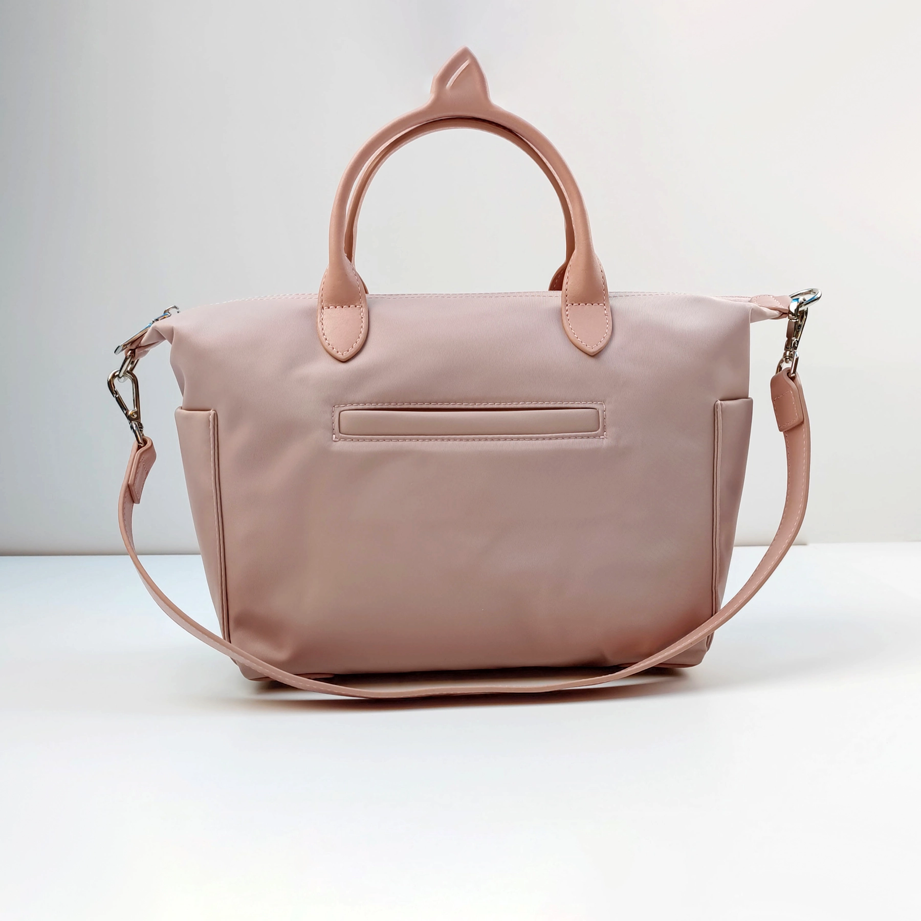 Pink handbag sample with handle and strap for custom handbag manufacturing