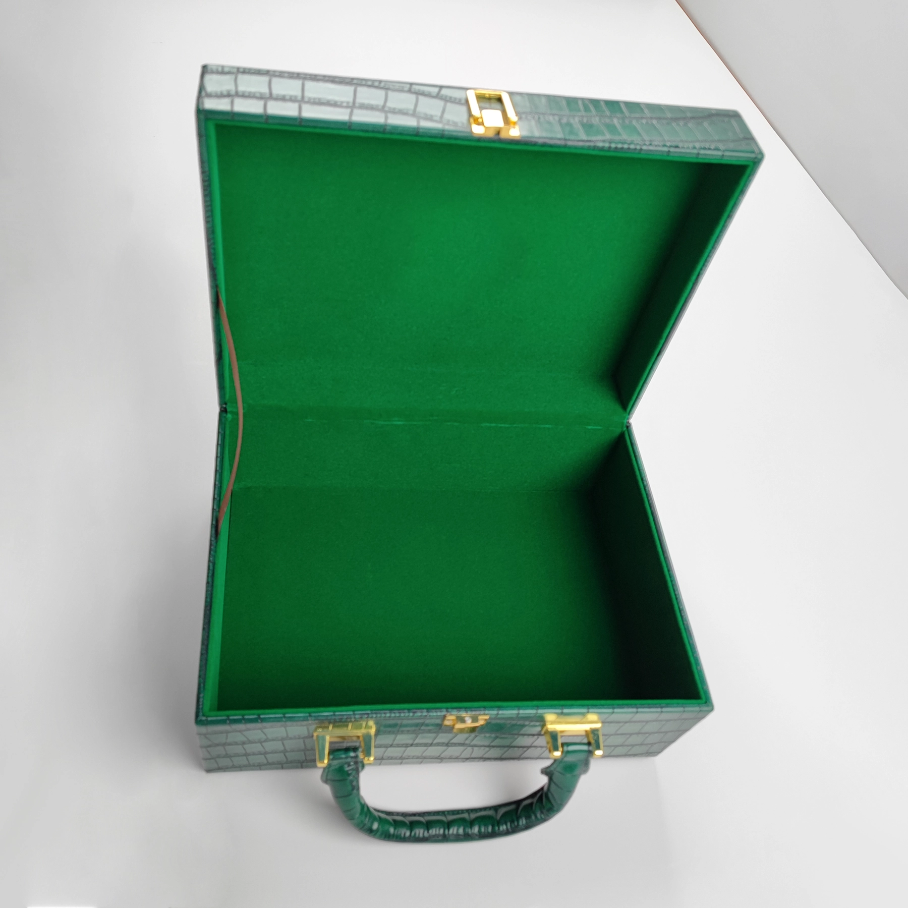 Open structured handbag sample with green lining for private label handbag production