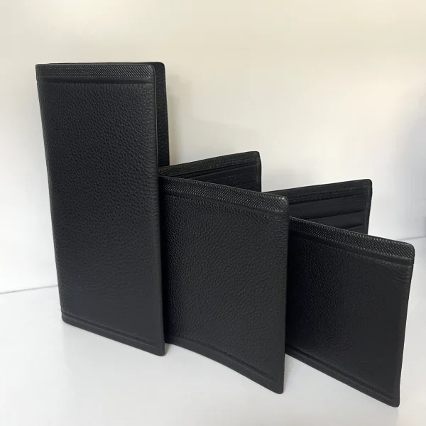 Black leather wallets displayed for private label handbag production review