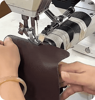 Industrial sewing unit stitching leather panels for custom handbag manufacturing