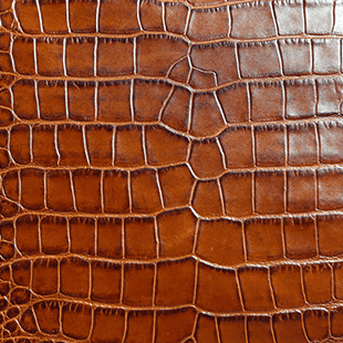 Crocodile-embossed leather panel texture for custom handbag manufacturing material review