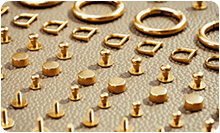 Metal handbag hardware components arranged for custom handbag manufacturing review