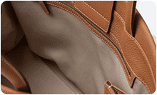 Interior lining and zipper opening documented for custom handbag manufacturing review