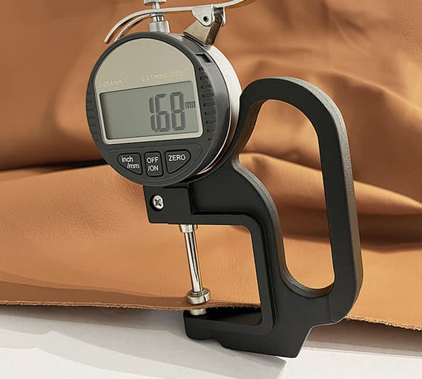 Leather thickness gauge measuring material panel for custom handbag manufacturing