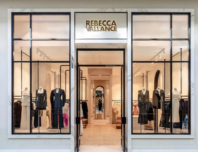 Fashion boutique storefront display used for private label handbag production reference