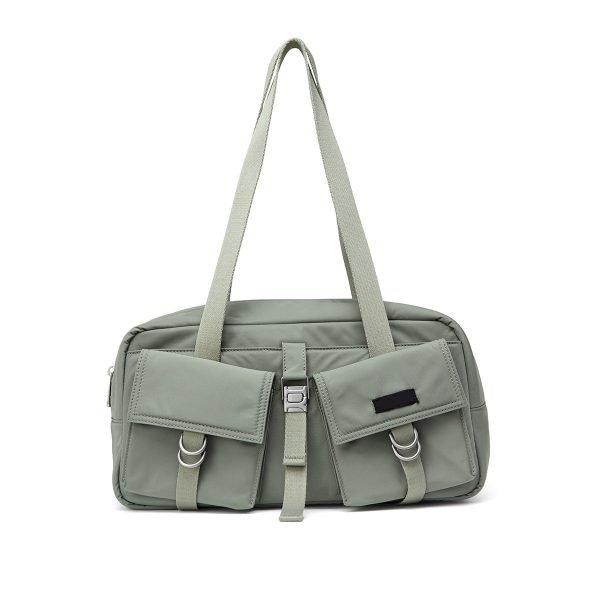 Custom handbag manufacturer sample with dual front pockets and strap hardware