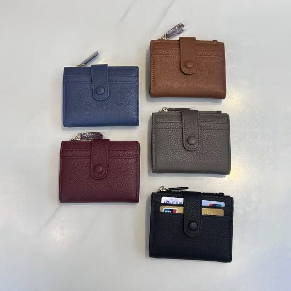 Five leather wallet samples arranged for private label handbag production review