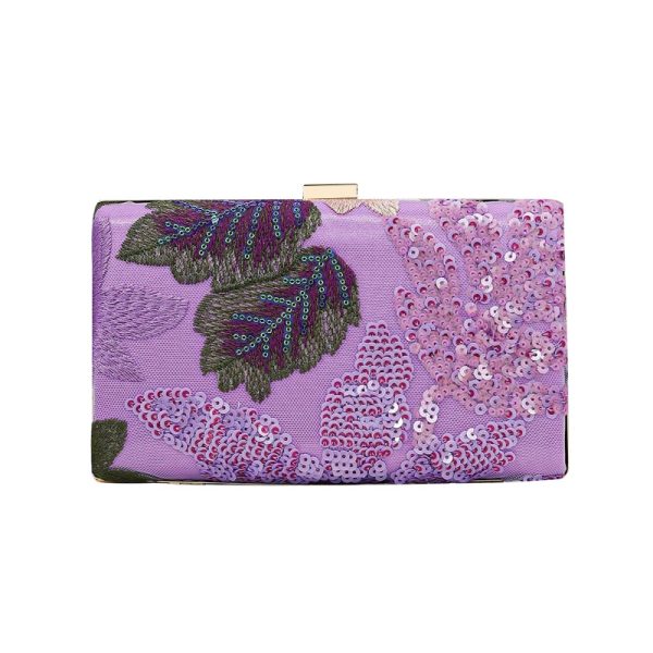 Private label handbag production clutch sample with sequined floral textile surface