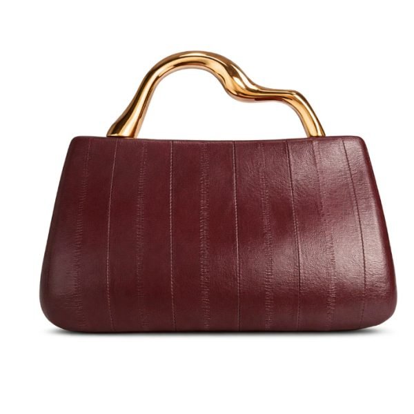 Structured handbag sample with metal handle for private label handbag production