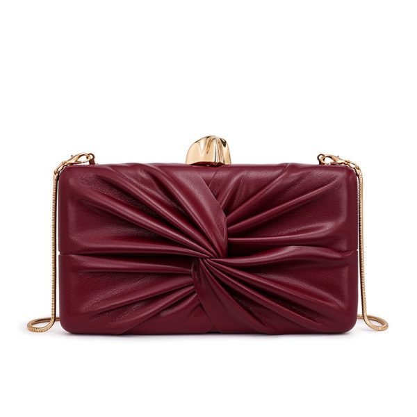 Custom handbag manufacturer sample showing red pleated clutch with chain strap