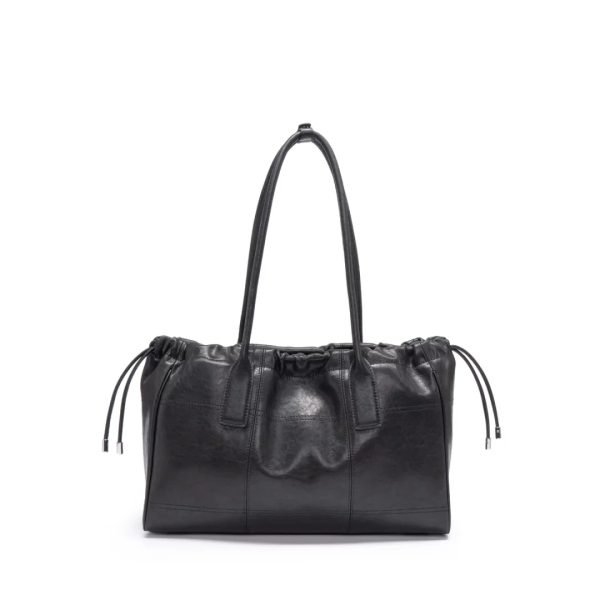 Black leather tote sample documented for custom handbag manufacturing review