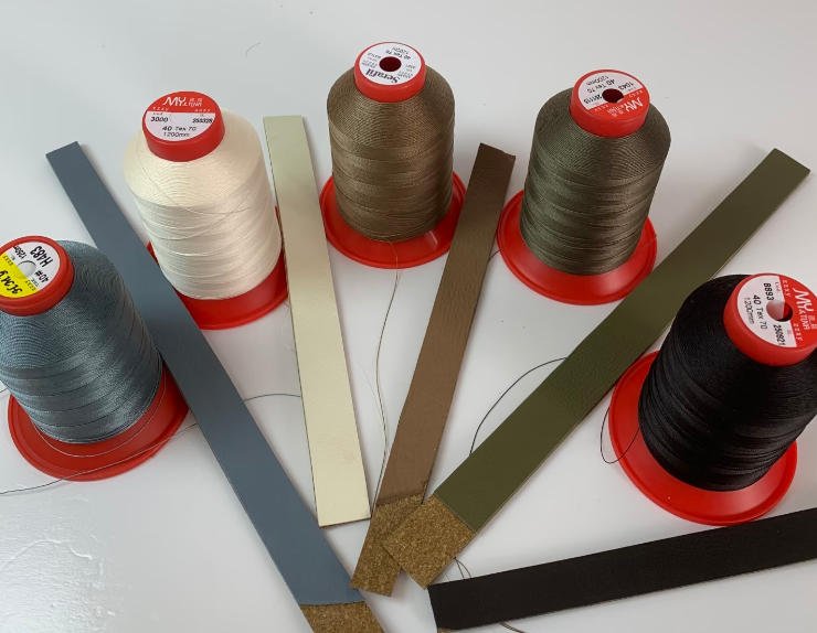 Leather strips and matching Serafil sewing threads prepared for custom handbag development