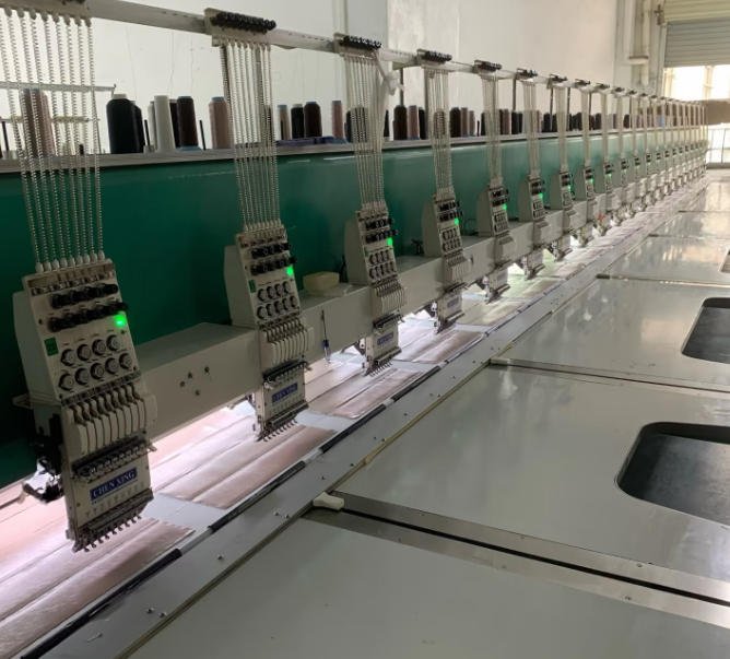 Multi-head embroidery machines in our custom bag embroidery workshop