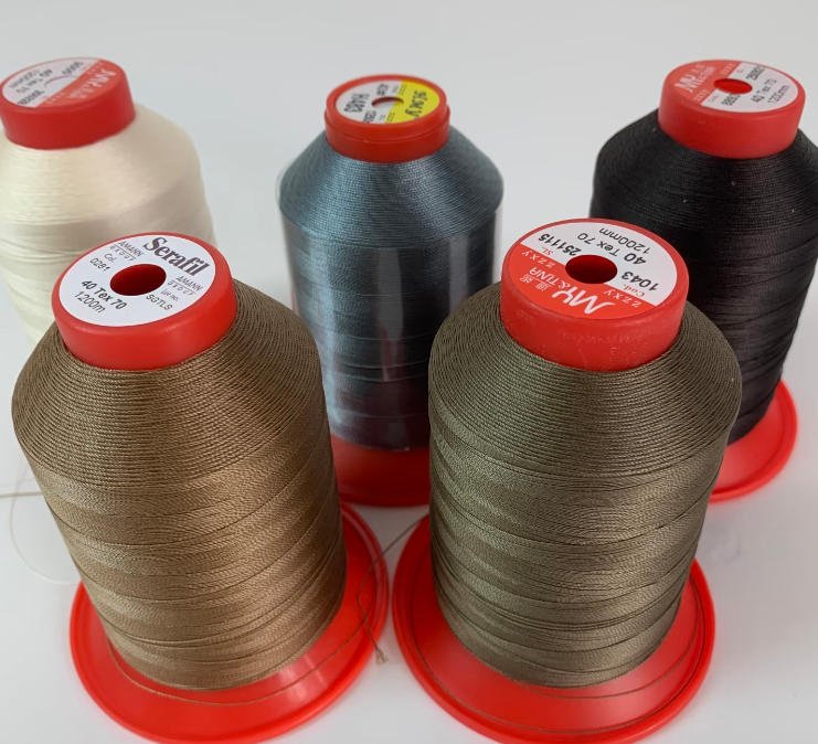 Multiple Serafil sewing thread shades selected for comparison during leather bag development